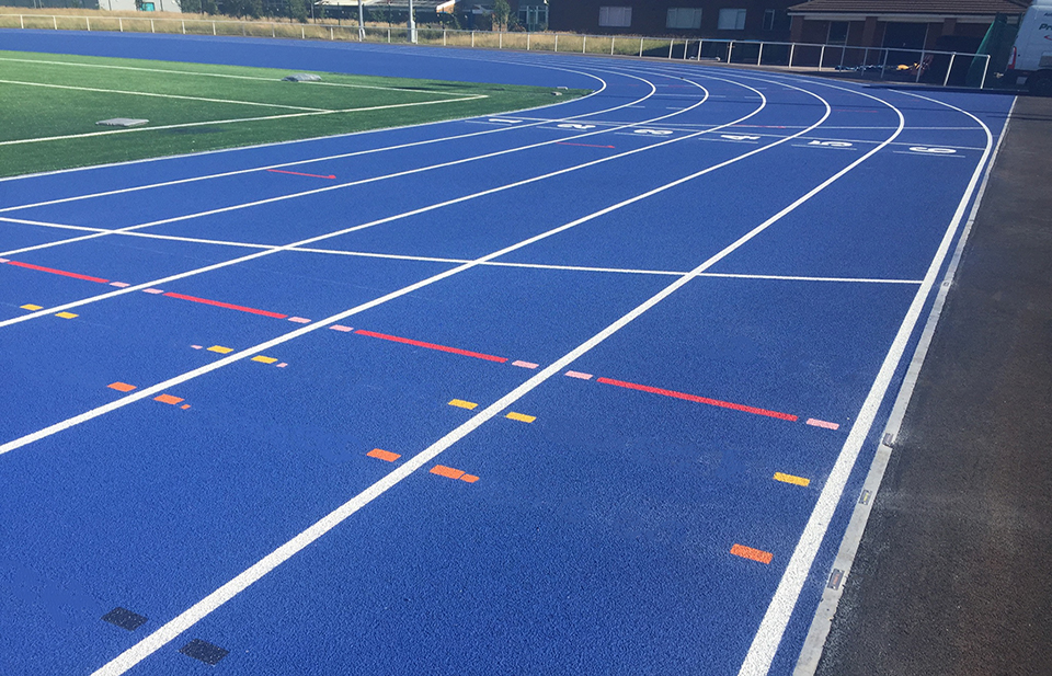 Image of an attractive blue professional standard running track