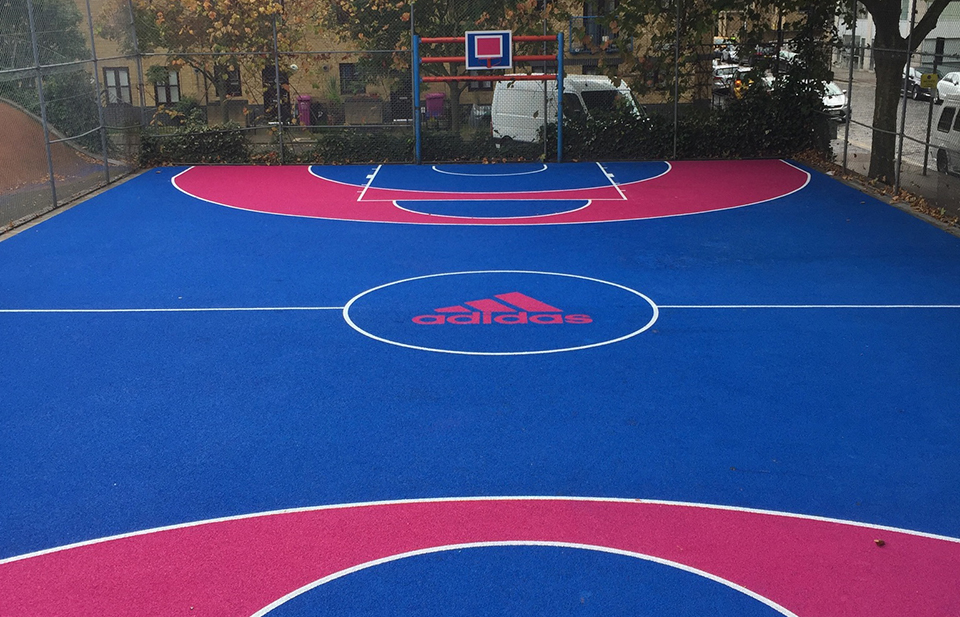 Image of a traditional basket ball court with branding