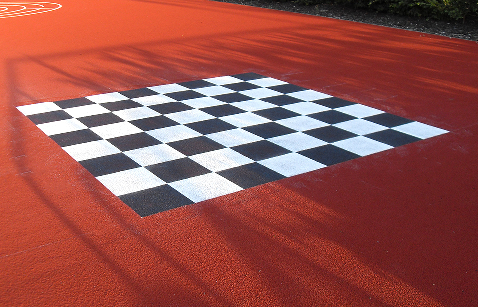 Image of chessboard on a play area surface